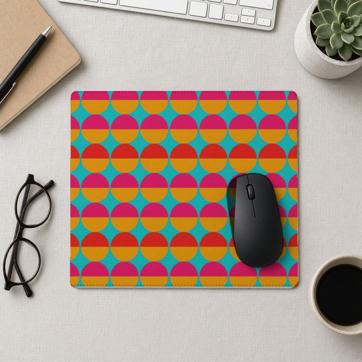 Half-Moon Stack vegan leather mouse mat from above with a mouse, notebook and glasses
