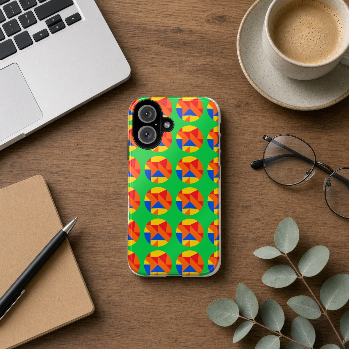 Broken Circle Planes tough phone case on a wooden desk beside a laptop, coffee and eucalyptus