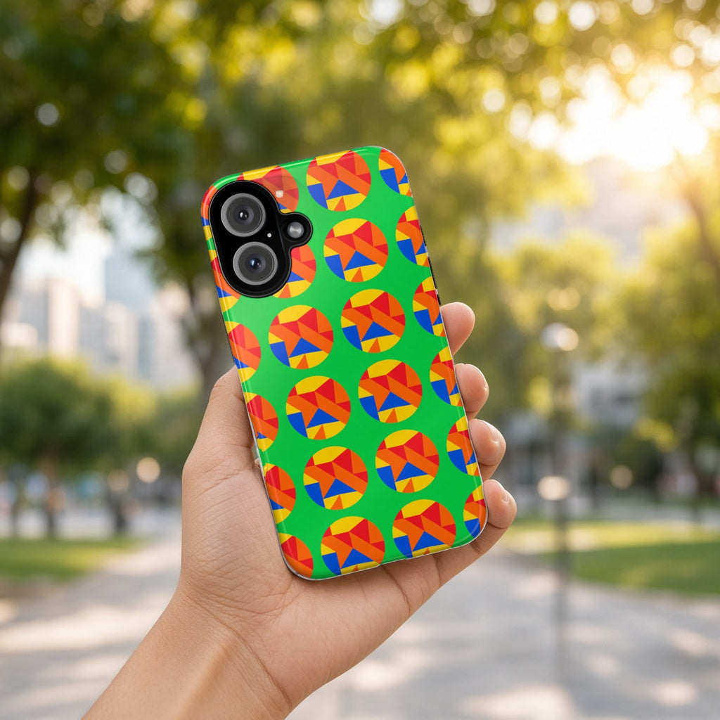 Hand holding the Broken Circle Planes tough phone case outdoors in a sunny park