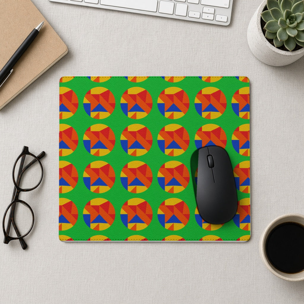 Broken Circle Planes vegan leather mouse mat from above with a mouse, notebook and glasses