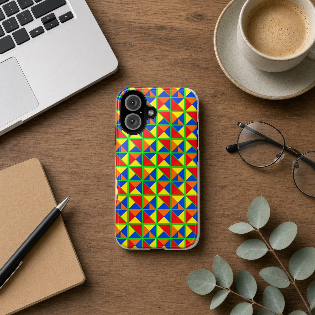 Split Square Fiesta tough phone case on a wooden desk beside a laptop, coffee and eucalyptus
