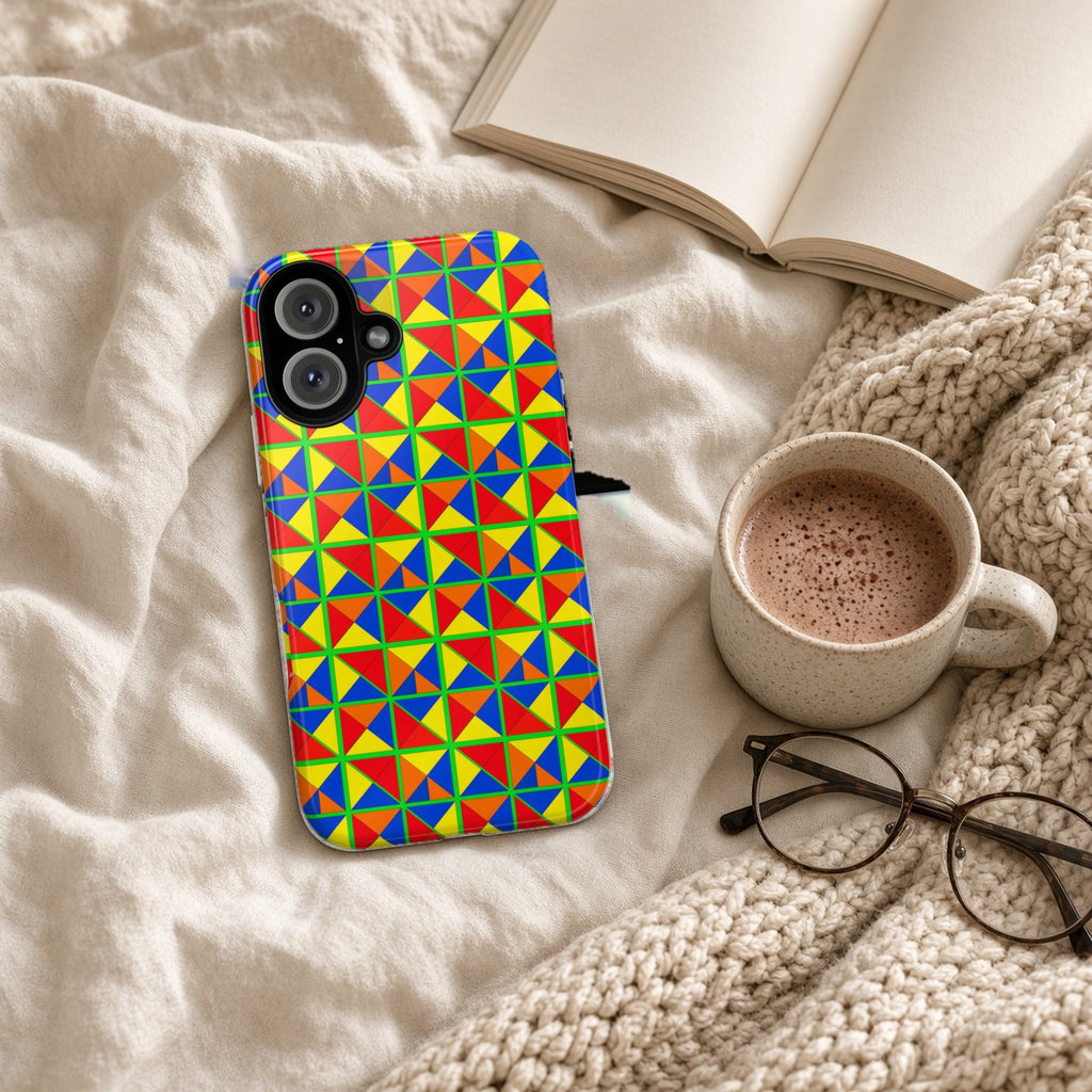 Split Square Fiesta tough phone case on a cosy knit blanket with a hot chocolate and glasses