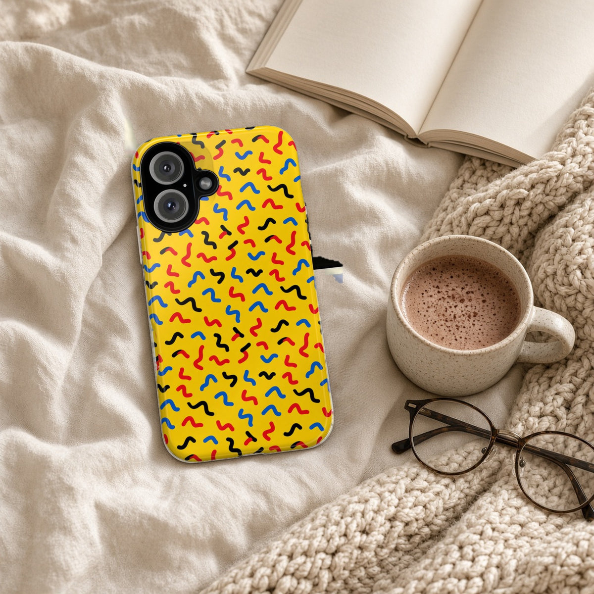 Squiggle Strokes Yellow tough phone case on a cosy knit blanket with a hot chocolate and glasses