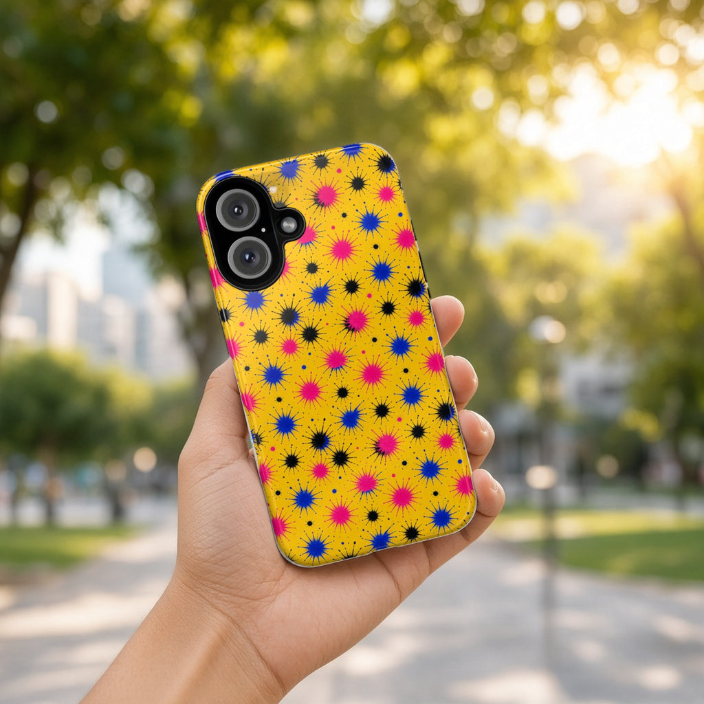 Hand holding the Splash Crowns tough phone case outdoors in a sunny park