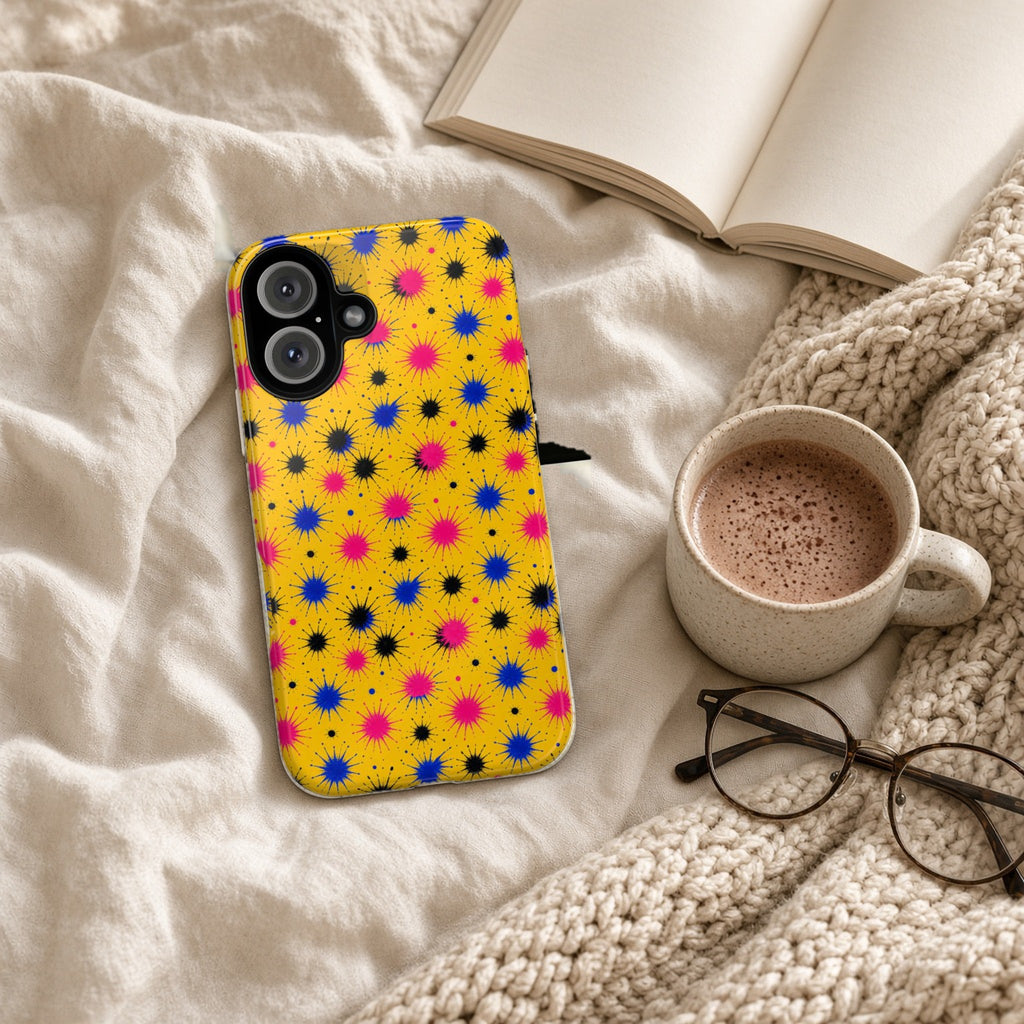 Splash Crowns tough phone case on a cosy knit blanket with a hot chocolate and glasses