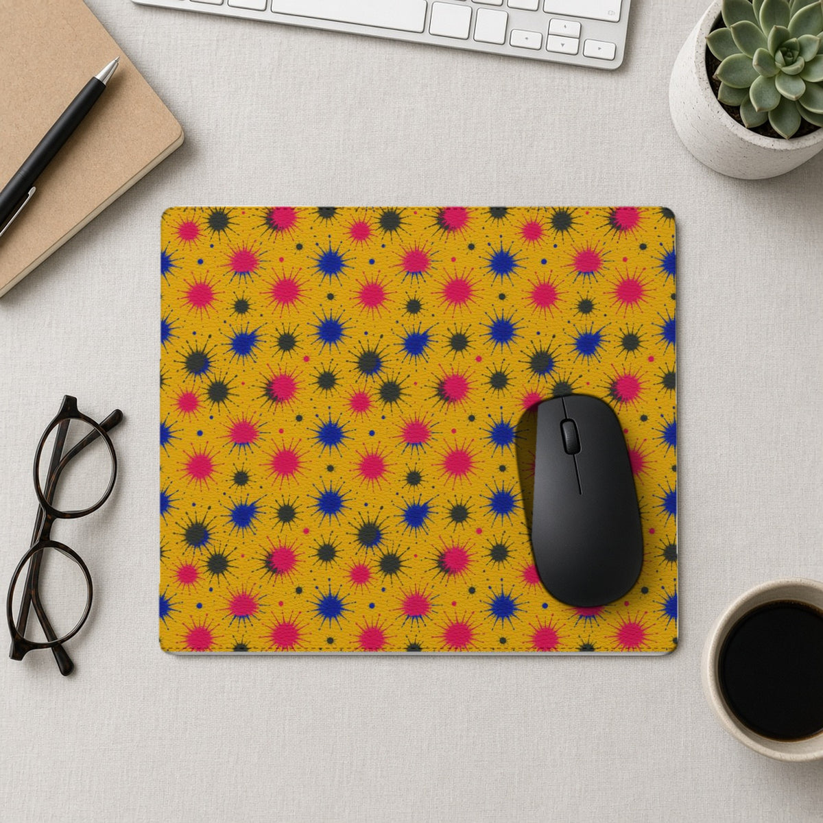 Splash Crowns vegan leather mouse mat from above with a mouse, notebook and glasses