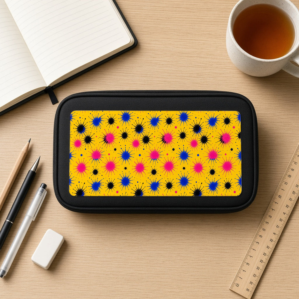 Splash Crowns pencil case on a wooden desk with notebook, pens and a cup of tea